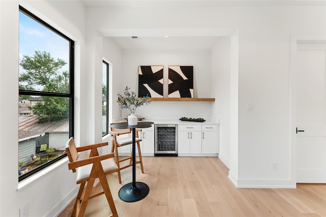 1741 Chippendale Rd, Houston, TX 77018 - indoor dry bar with beverage cooler and light wood-style floors