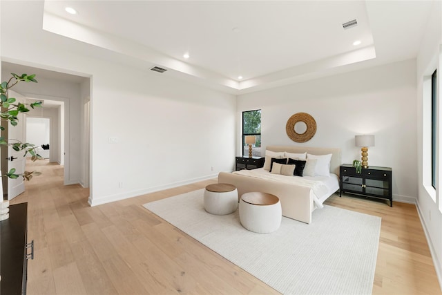 1741 Chippendale Rd, Houston, TX 77018 - bedroom featuring a raised ceiling, light wood finished floors, and recessed lighting