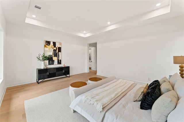 1741 Chippendale Rd, Houston, TX 77018 - bedroom featuring a raised ceiling, light wood-style flooring, and recessed lighting
