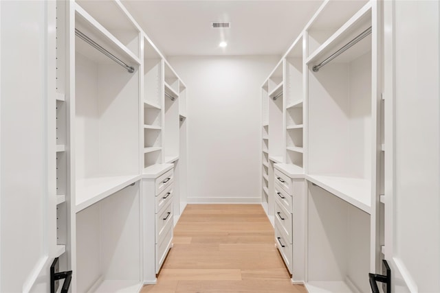 1741 Chippendale Rd, Houston, TX 77018 - walk in closet with light wood-type flooring
