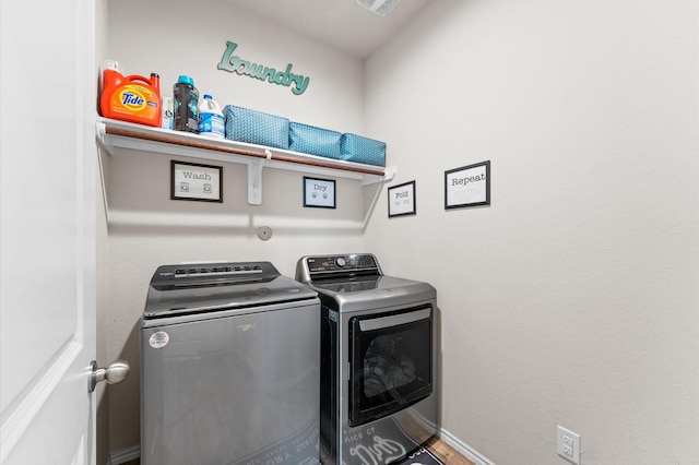 11375 Dawn Beach Ln, Conroe, TX 77304 - washroom with washing machine and clothes dryer