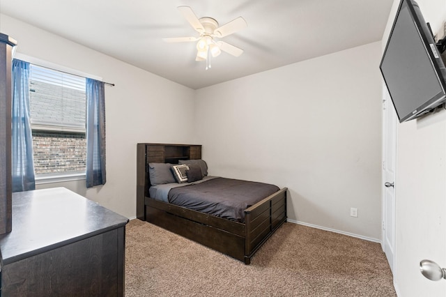 11375 Dawn Beach Ln, Conroe, TX 77304 - bedroom with carpet floors, multiple windows, a ceiling fan, and baseboards