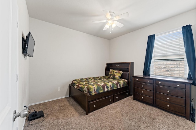 11375 Dawn Beach Ln, Conroe, TX 77304 - bedroom featuring carpet, baseboards, and a ceiling fan