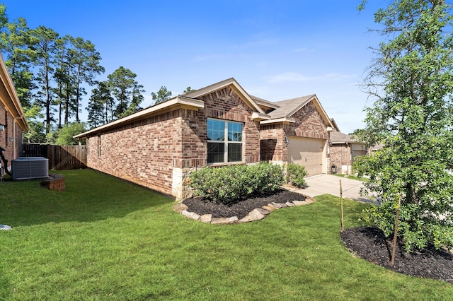 11375 Dawn Beach Ln, Conroe, TX 77304 - view of property exterior featuring brick siding, central air condition unit, concrete driveway, and a garage
