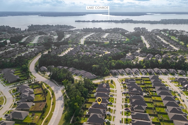 11375 Dawn Beach Ln, Conroe, TX 77304 - aerial view of property and surrounding area with a large body of water and nearby suburban area