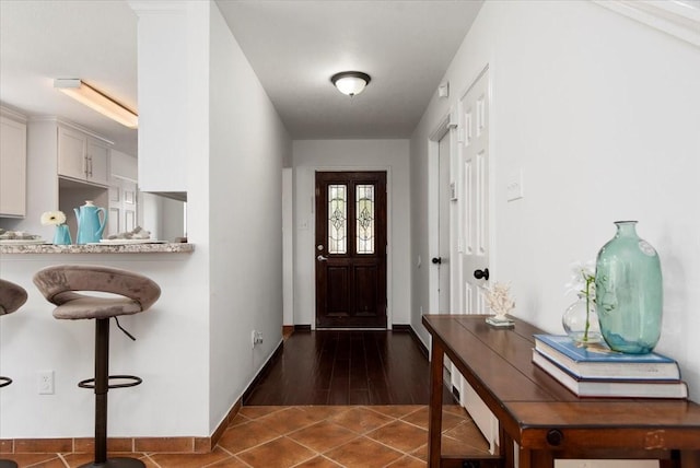 8702 Cold Lake Dr, Houston, TX 77088 - entrance foyer with baseboards and dark tile patterned flooring