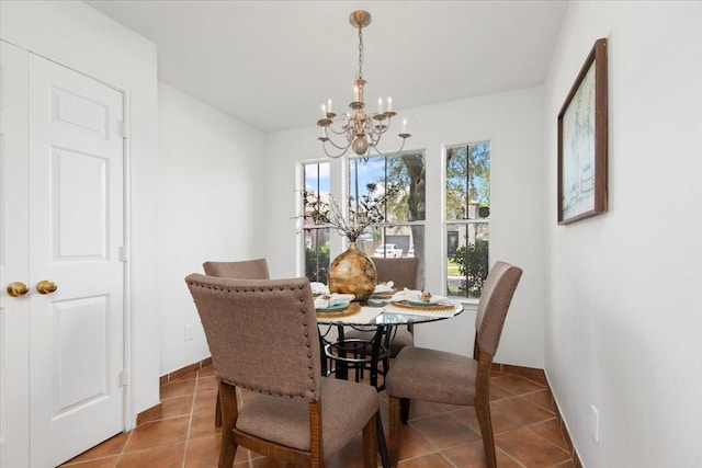 8702 Cold Lake Dr, Houston, TX 77088 - tiled dining room with a chandelier and baseboards
