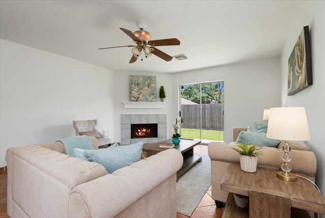 8702 Cold Lake Dr, Houston, TX 77088 - living area with a ceiling fan and a tiled fireplace