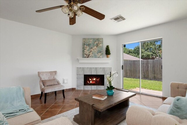 8702 Cold Lake Dr, Houston, TX 77088 - tiled living area featuring a tiled fireplace and ceiling fan