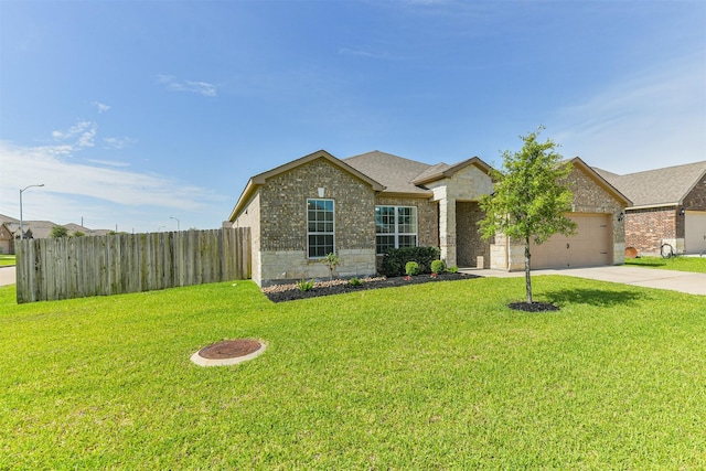22303 Bauer Garden Dr, Hockley, TX 77447 - view of front facade featuring concrete driveway, a garage, brick siding, and stone siding