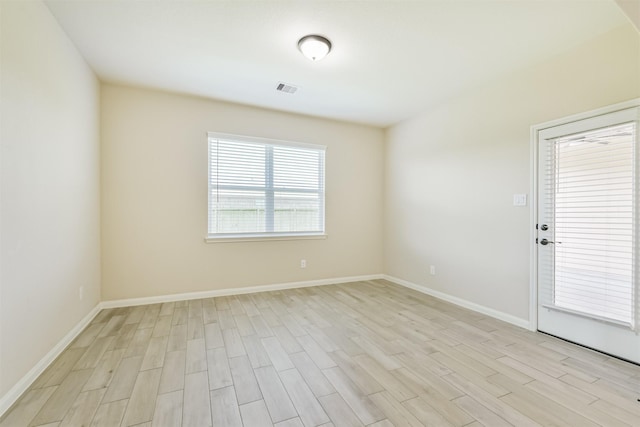 22303 Bauer Garden Dr, Hockley, TX 77447 - spare room with light wood-style floors and baseboards