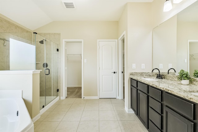 22303 Bauer Garden Dr, Hockley, TX 77447 - full bathroom with a stall shower, a spacious closet, double vanity, a bath, and tile patterned flooring