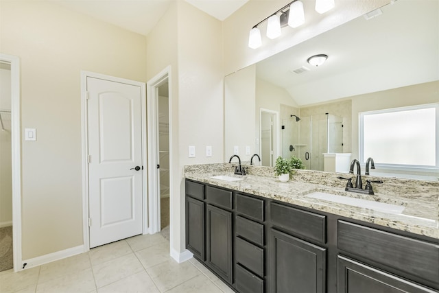 22303 Bauer Garden Dr, Hockley, TX 77447 - bathroom with a walk in closet, a stall shower, double vanity, tile patterned flooring, and lofted ceiling