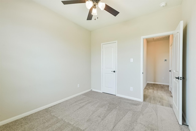 22303 Bauer Garden Dr, Hockley, TX 77447 - unfurnished bedroom with carpet flooring, baseboards, and a ceiling fan