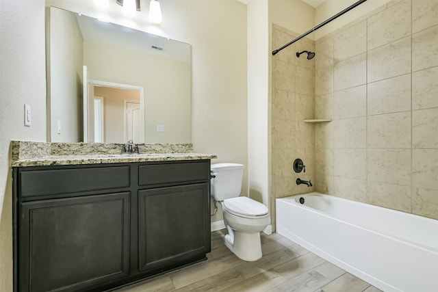22303 Bauer Garden Dr, Hockley, TX 77447 - full bath featuring toilet, vanity, wood finished floors, and bathing tub / shower combination