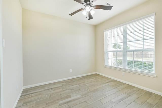 22303 Bauer Garden Dr, Hockley, TX 77447 - empty room with ceiling fan, light wood-type flooring, and baseboards