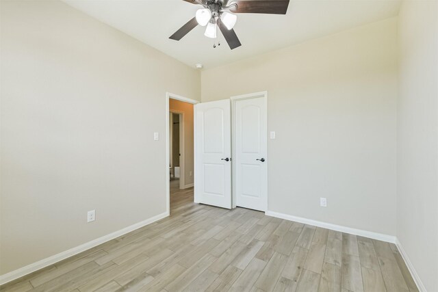 22303 Bauer Garden Dr, Hockley, TX 77447 - spare room with light wood-style floors, baseboards, and a ceiling fan