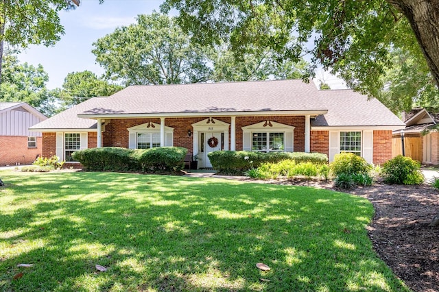 915 Timber Cove Dr, Seabrook, TX 77586 - ranch-style house featuring brick siding, a front yard, and roof with shingles