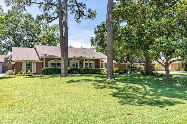 915 Timber Cove Dr, Seabrook, TX 77586 - ranch-style house with brick siding and a shingled roof