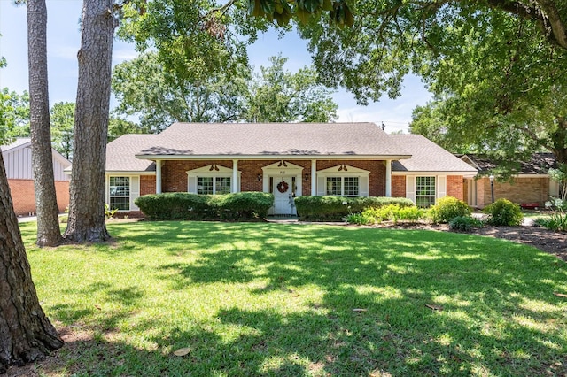 915 Timber Cove Dr, Seabrook, TX 77586 - ranch-style house with brick siding, a front lawn, and a shingled roof