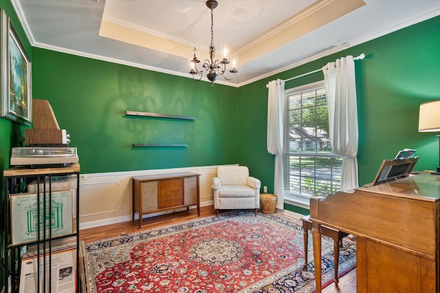 915 Timber Cove Dr, Seabrook, TX 77586 - office area featuring wood finished floors, healthy amount of natural light, a raised ceiling, ornamental molding, and a chandelier