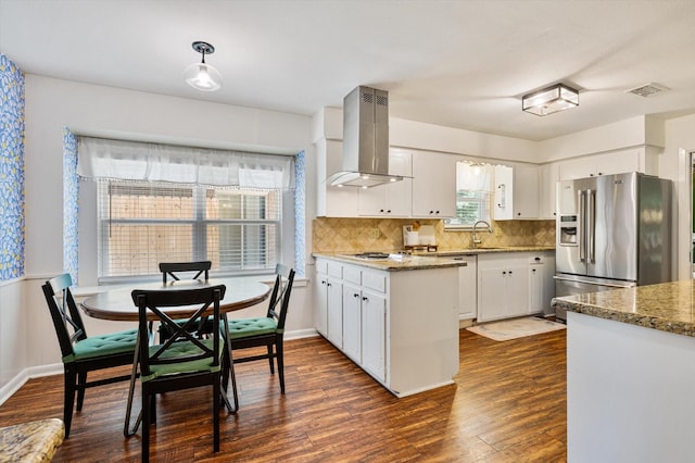 915 Timber Cove Dr, Seabrook, TX 77586 - kitchen with island range hood, stainless steel fridge with ice dispenser, a sink, dark wood-style floors, and white cabinets