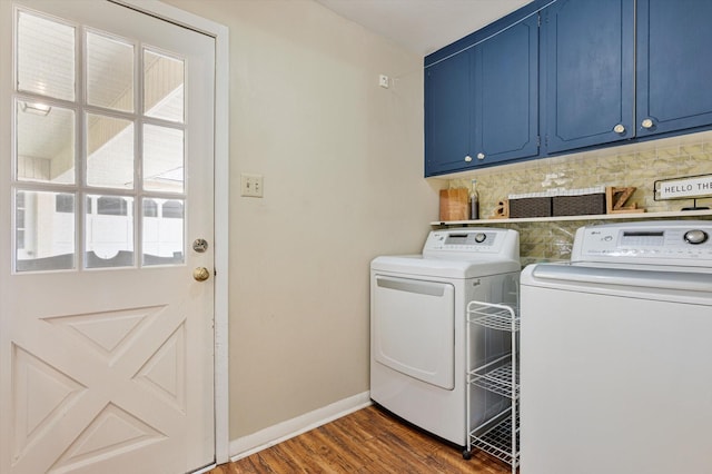 915 Timber Cove Dr, Seabrook, TX 77586 - laundry area featuring cabinet space, washing machine and dryer, dark wood-style flooring, and baseboards