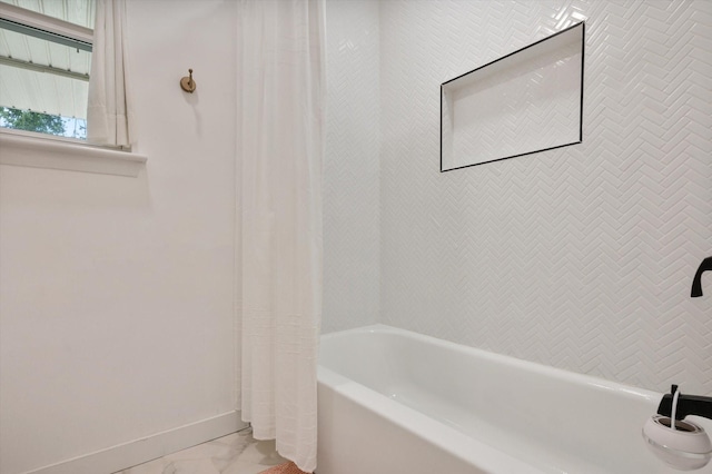 915 Timber Cove Dr, Seabrook, TX 77586 - full bathroom featuring baseboards, shower / bath combination with curtain, and marble finish flooring