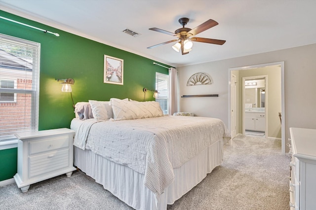 915 Timber Cove Dr, Seabrook, TX 77586 - bedroom with light carpet, ornamental molding, baseboards, a ceiling fan, and ensuite bath