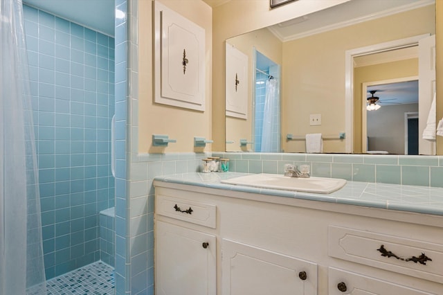 915 Timber Cove Dr, Seabrook, TX 77586 - bathroom with vanity, tiled shower, ceiling fan, ornamental molding, and tile walls