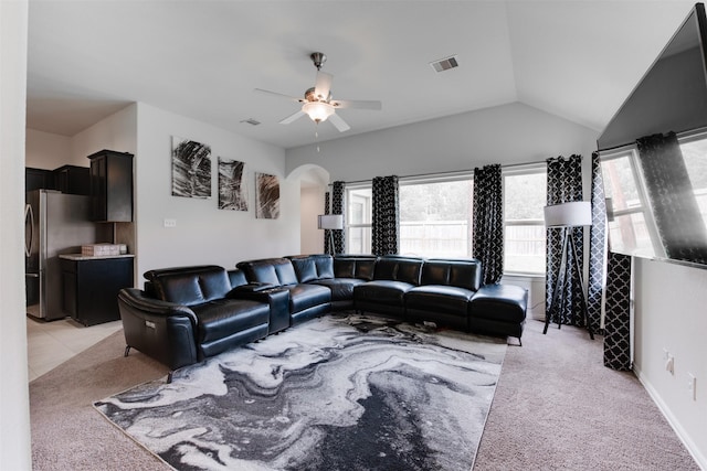 6734 Camden Valley Ct, Houston, TX 77084 - living room with ceiling fan, arched walkways, light carpet, and vaulted ceiling