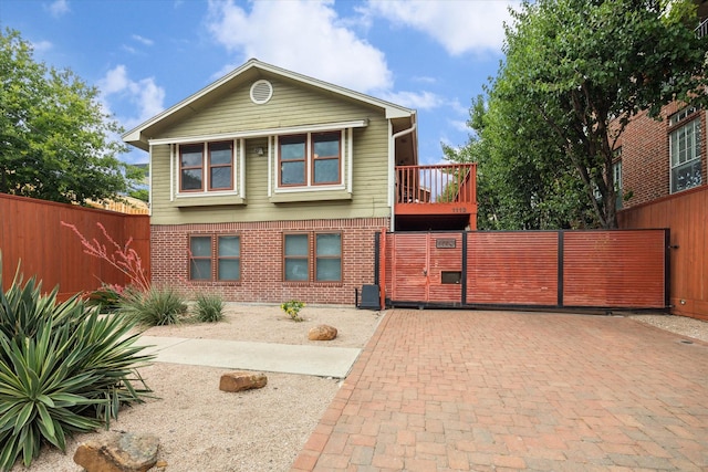 1112 Jackson Blvd, Houston, TX 77006 - view of front of house featuring brick siding and a gate