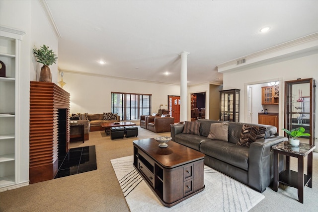 1112 Jackson Blvd, Houston, TX 77006 - living room with light colored carpet, crown molding, ornate columns, and recessed lighting