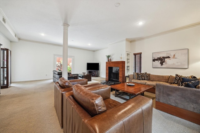 1112 Jackson Blvd, Houston, TX 77006 - living room featuring light carpet, crown molding, ornate columns, recessed lighting, and a fireplace