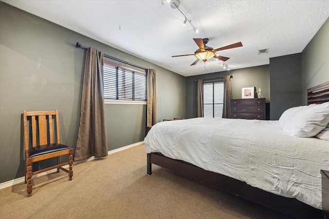 1112 Jackson Blvd, Houston, TX 77006 - bedroom with multiple windows, carpet flooring, baseboards, and a ceiling fan