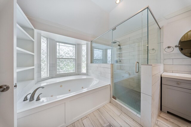 1818 Hillgreen Dr, Katy, TX 77494 - full bathroom featuring a tub with jets, a shower stall, ornamental molding, wood finished floors, and vanity