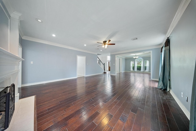 1818 Hillgreen Dr, Katy, TX 77494 - unfurnished living room with stairs, a fireplace with flush hearth, wood-type flooring, a chandelier, and crown molding