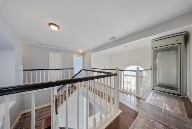 1818 Hillgreen Dr, Katy, TX 77494 - hall featuring attic access, wood-type flooring, and an upstairs landing