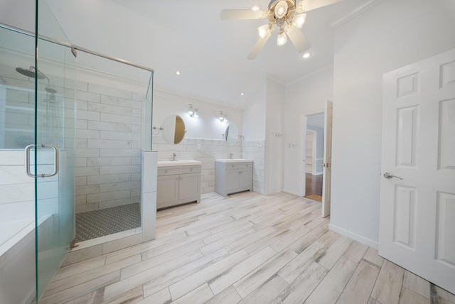 1818 Hillgreen Dr, Katy, TX 77494 - bathroom with ornamental molding, vanity, a stall shower, ceiling fan, and wood finished floors