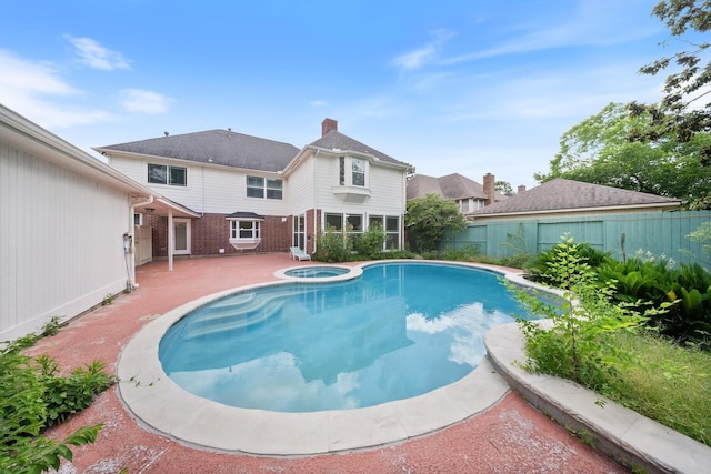 1818 Hillgreen Dr, Katy, TX 77494 - view of swimming pool with a patio, a fenced backyard, and a pool with connected hot tub
