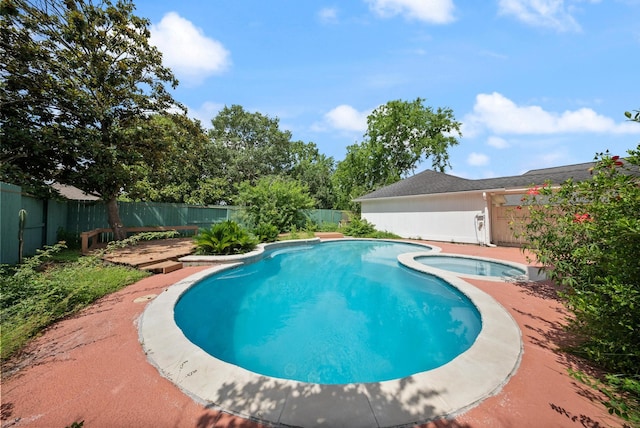 1818 Hillgreen Dr, Katy, TX 77494 - view of swimming pool with a fenced backyard, a wooden deck, and a pool with connected hot tub