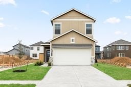 6418 Bolinas Ct, Rosharon, TX 77583 - view of front of house with concrete driveway, a front yard, and a garage