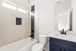 6418 Bolinas Ct, Rosharon, TX 77583 - bathroom featuring vanity, toilet, and bathing tub / shower combination