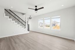 6418 Bolinas Ct, Rosharon, TX 77583 - unfurnished living room with baseboards, a ceiling fan, wood finished floors, and recessed lighting