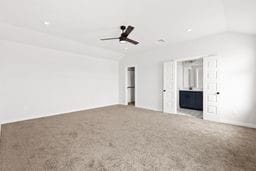 6418 Bolinas Ct, Rosharon, TX 77583 - unfurnished living room with carpet, a ceiling fan, vaulted ceiling, and baseboards