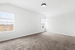 6418 Bolinas Ct, Rosharon, TX 77583 - bonus room featuring lofted ceiling, carpet flooring, and baseboards