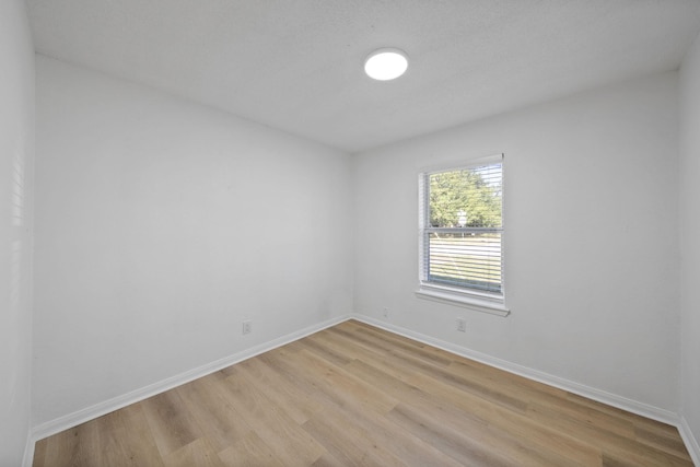 700 Lyle W Ave Unit B, Cleveland, TX 77327 - unfurnished room featuring light wood-type flooring and baseboards