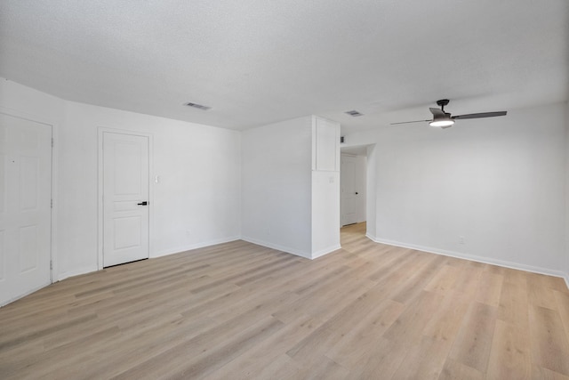 700 Lyle W Ave Unit B, Cleveland, TX 77327 - unfurnished room featuring light wood-style flooring, ceiling fan, and baseboards