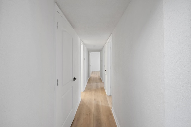 700 Lyle W Ave Unit B, Cleveland, TX 77327 - hall with light wood-style flooring and baseboards