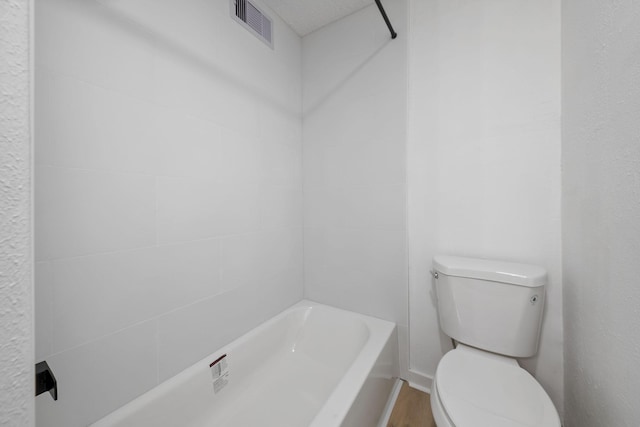 700 Lyle W Ave Unit B, Cleveland, TX 77327 - bathroom featuring toilet and wood finished floors